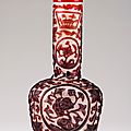 A red glass overlay bottle, <b>Incised</b> <b>Qianlong</b> <b>four</b>-<b>character</b> <b>mark</b> and of the period (1736-95)