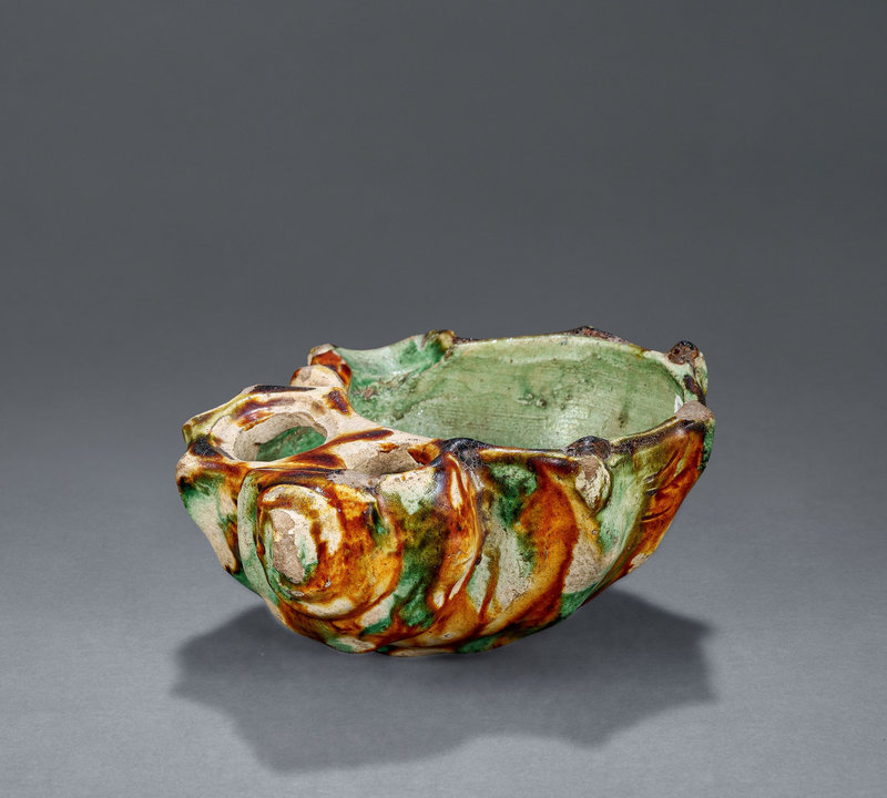 A sancai-glazed conch-shaped vessel, Tang dynasty (618-907)