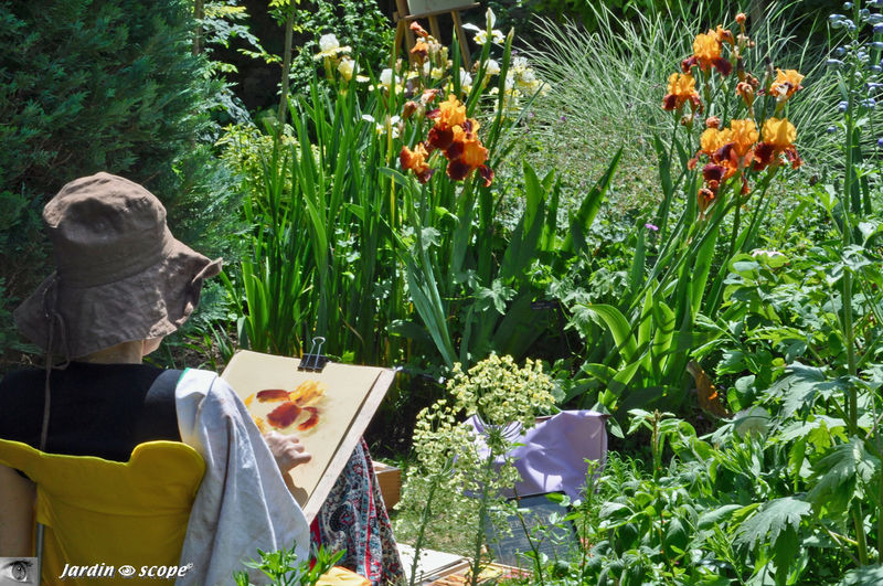 Aquarelliste s'adonnant à son art dans le jardin d'André