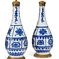 A pair of ormolu-mounted Chinese porcelain <b>blue</b> and white bottle vases