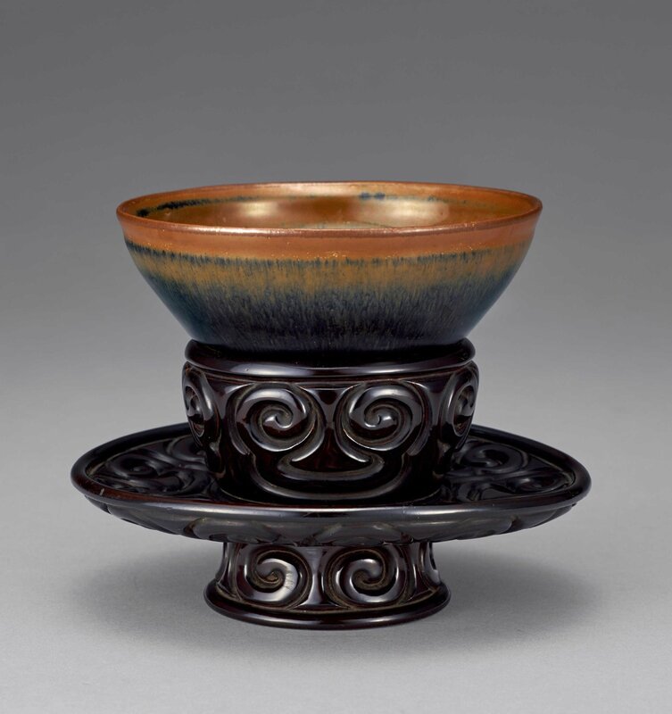 A Jian “hare's fur” Tenmoku tea bowl and a tixi rhinoceros horn bowl stand, Song to Yuan dynasty (960-1368)