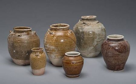 A_group_of_six_glazed_pottery_jarsa