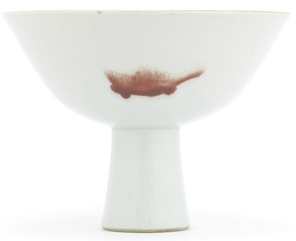 A copper-red 'three fish' stem bowl, Yongzheng six-character mark and of the period (1723-1735)