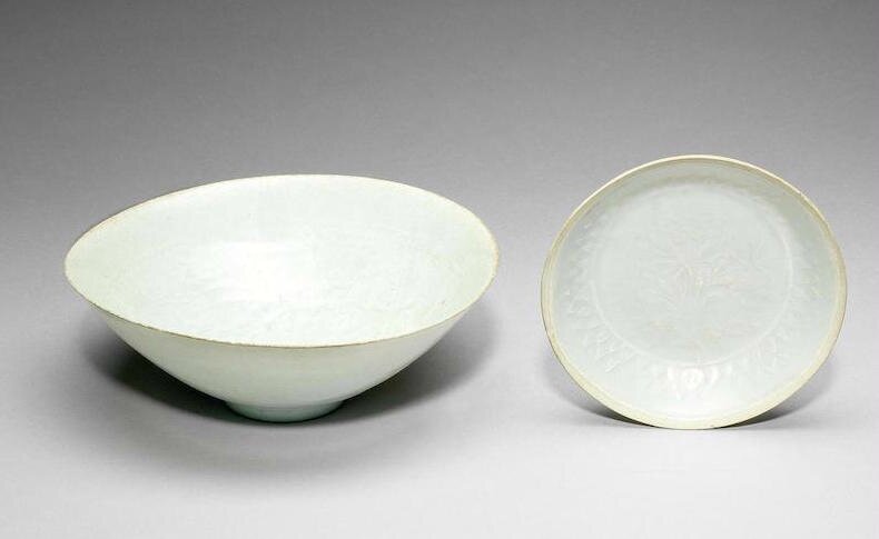 A Qingbai carved conical 'boys and peony' bowl, Southern Song Dynasty