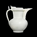 A rare incised white-glazed 'monk's <b>cap</b>' ewer, Ming dynasty, Yongle period 