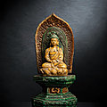 A sancai-glazed pottery figure of seated Buddha on a throne, <b>Wanli</b> period, dated by inscription 1584