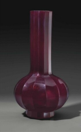 A red glass faceted bottle vase, China, Qing dynasty, 18th century