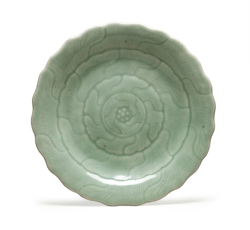 A celadon-glazed 'Lotus' dish, Qianlong four-character seal mark in underglaze blue and of the period (1736-1795)