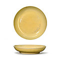 A yellow-glazed dish, <b>Hongzhi</b> six-character mark in underglaze blue within a double circle and of the period (1488-1505)
