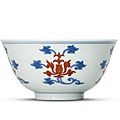 A fine <b>iron</b>-<b>red</b> <b>decorated</b> <b>blue</b> <b>and</b> <b>white</b> 'Lotus' tea bowl, Yongzheng six-character mark <b>and</b> of the period