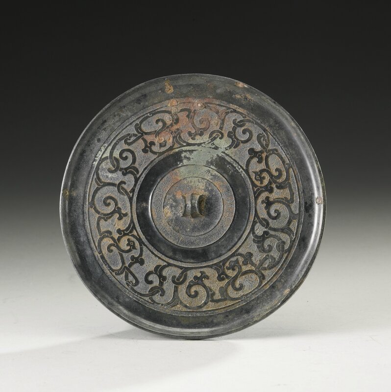 A bronze 'dragon' mirror, Warring States period