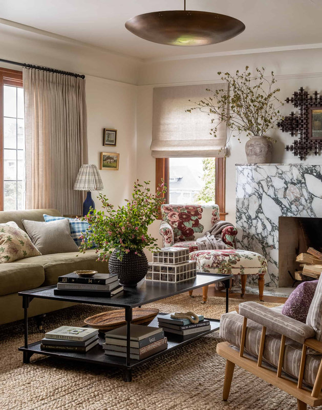 Heidi-Caillier-Design-Seattle-interior-designer-N28-Tudor-printed-floral-chair-green-roll-arm-sofa-living-room-tapered-british-design-spindle-chairs