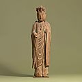 A carved wood figure of a <b>boddhisattva</b>, Ming dynasty (1368-1644)