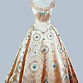  Norman Hartnell, Cream <b>crinoline</b> gown with blue embroidery