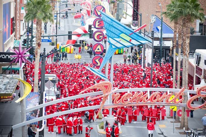 santas_line_up_at_fremont_street_experience_at_las_vegas_great_santa_run_photo_courtesy_opportunity_village