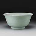 A large <b>molded</b> celadon-glazed <b>bowl</b>, Qianlong seal mark and period (1736-1795)
