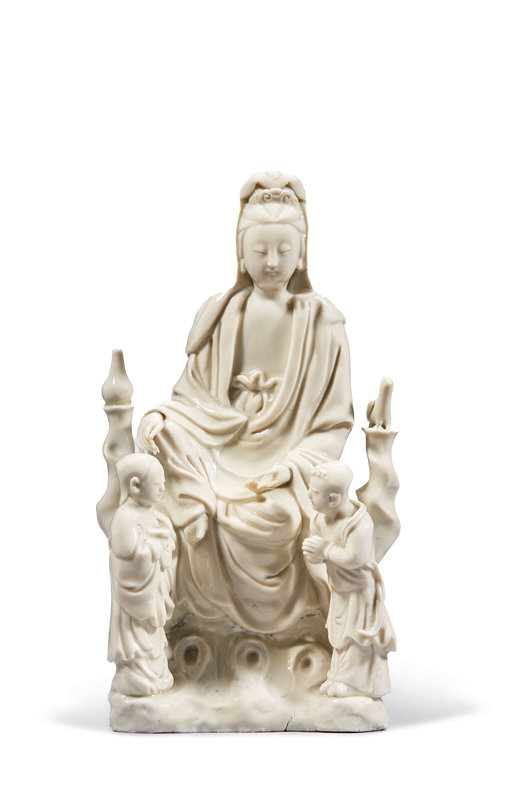 A Dehua group of a seated Guanyin and two attendants, Late Ming dynasty, circa 1640