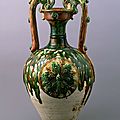 Three-color glazed <b>vase</b> <b>with</b> <b>dragon</b> handles and applied medallions, Tang Dynasty, 8th century