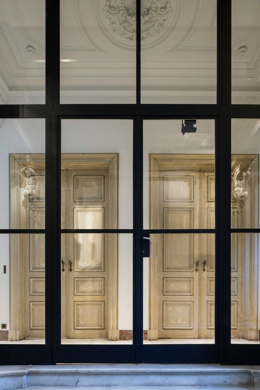 paneled-wood-doors-ornate-ceiling-