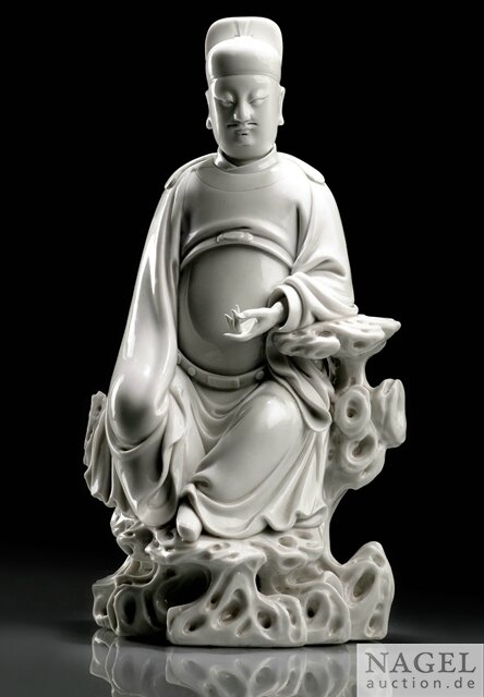 A finely modeled Dehua figure of Wen Chang, impressed gourd-shaped potter's mark He Chaozong, 17th century