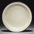A molded Dingyao dish, <b>Jin</b> <b>dynasty</b> (1115-1234)