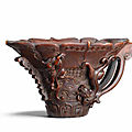 An exquisitely carved rhinoceros horn archaistic '<b>chilong</b>' <b>libation</b> <b>cup</b>, 17th-18th century