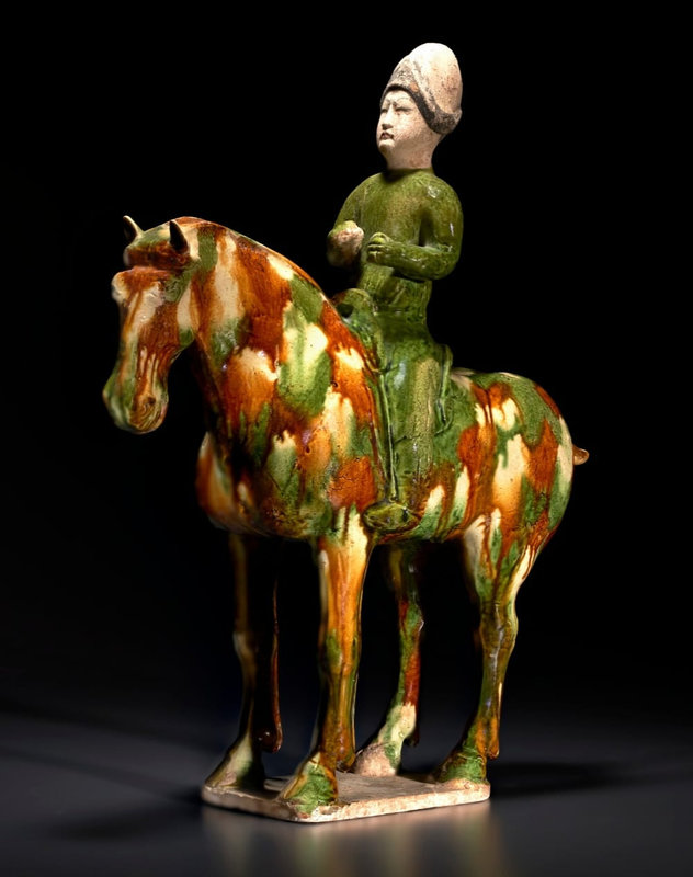 A rare and unusual sancai-glazed pottery equestrian, Tang dynasty (AD 618-907)