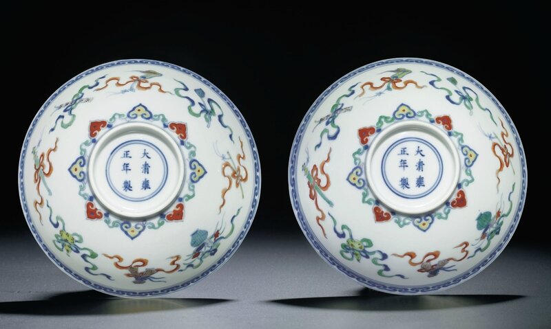 A fine pair of doucai 'Daoist emblems' bowls, Yongzheng six-character marks within double circles and of the period (1723-1735)