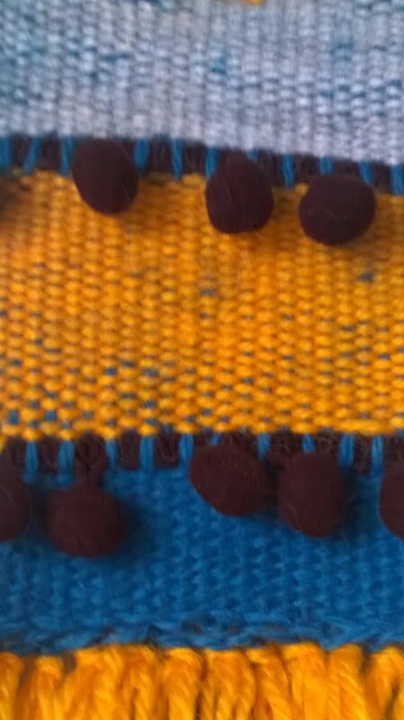 Laine et biais de pompons