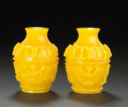 A_pair_of_yellow_glass_miniature_vases