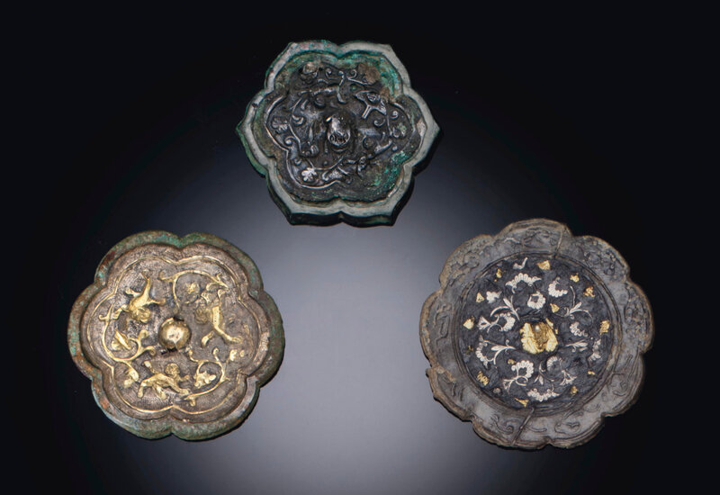 Three miniature silver-decorated bronze floriform mirrors, Tang dynasty (618-907)