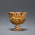 A marble-glazed <b>stem</b> <b>cup</b>, Tang dynasty (618-907)
