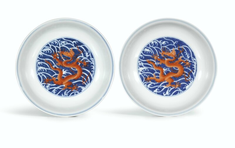 A pair of fine blue and white and iron-red 'Dragon' dishes, Seal marks and period of Qianlong