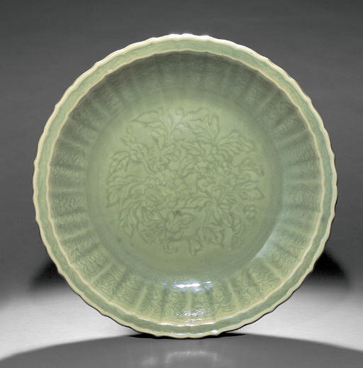 A fine and rare large Longquan celadon barbed 'Peony' dish, early Ming dynasty, late 14th-early 15th century