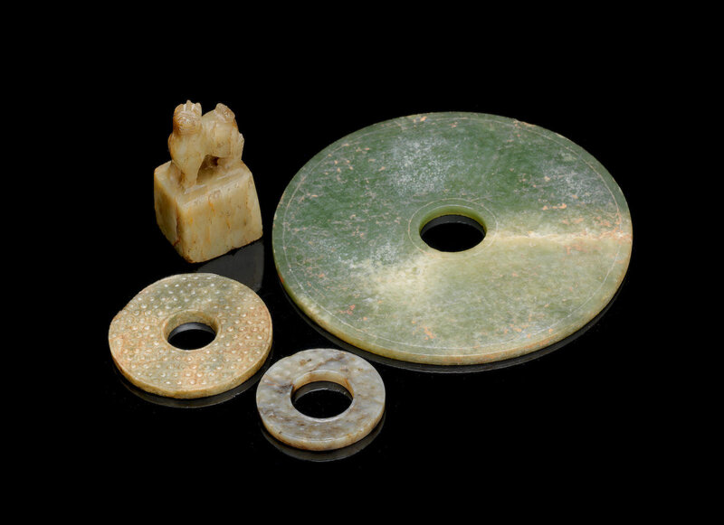 Three green and russet jade bi discs, Han Dynasty or later