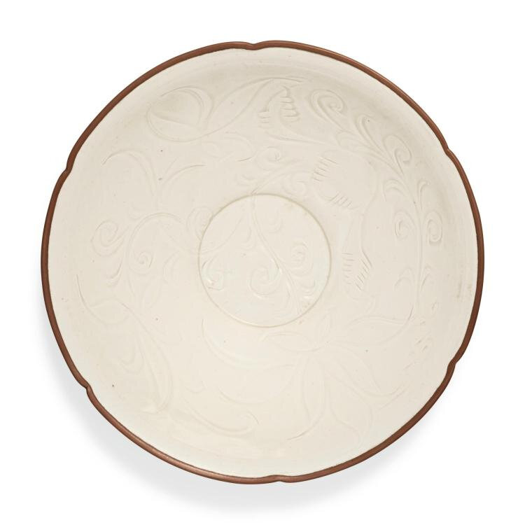 A fine and rare carved 'Ding' 'Lotus' bowl, Northern Song dynasty (960-1127)