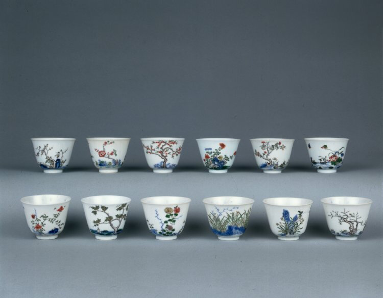 A set of twelve wucai month wine cups, Qing dynasty, Kangxi marks and period, about AD 1700