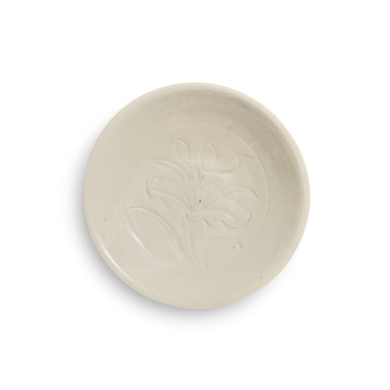 A carved 'Ding' 'lotus' dish, Northern Song dynasty