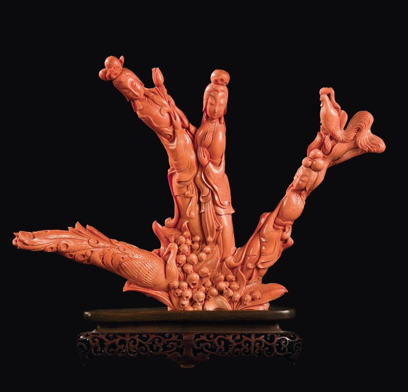 A large carved coral three Guanyin with peacock and rooster, China, Qing Dynasty, late 19th century