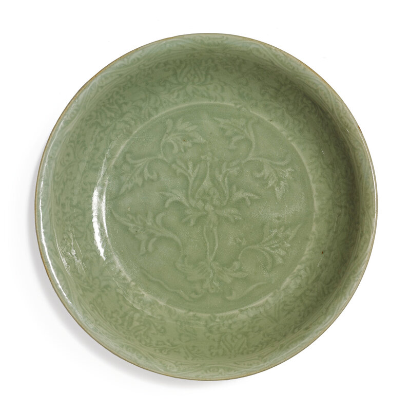 A carved 'Longquan' celadon-glazed dish, Ming dynasty, 15th century