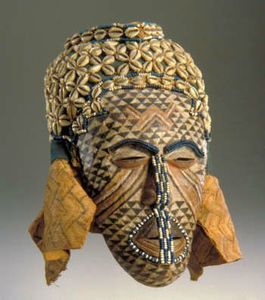 X JEU kuba- African, Kuba culture-Ngady amwaash Mask-1800s-1900s-Sculpture Wood paint glass beads cowrie shells string raffia cloth-Virginia Museum of Fine Arts