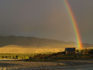 Rainbow_at_sunset_on_Tekapo_Lake__25_