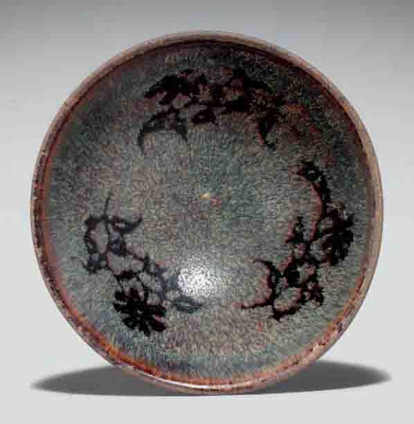 A paper-cut resist-decorated Jizhou bowl, Southern Song dynasty, 12th-13th century