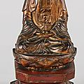 Bouddha en <b>bois</b> <b>laqué</b> <b>or</b> reposant sur un socle lotiforme. VIETNAM, XIXème siècle