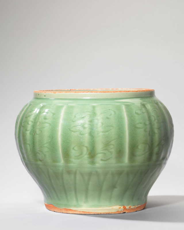 A rare Longquan celadon carved and moulded ‘Sea creatures’ jar, Yuan dynasty (1279-1368)
