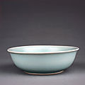 A rare <b>pale</b> <b>celadon</b>-glazed shallow bowl, dated by inscription to Wanli cyclical xinmao year, corresponding to 1591 and of the pe