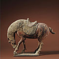 <b>A</b> rare painted pottery <b>figure</b> <b>of</b> <b>a</b> <b>horse</b> nuzzling its leg, Tang dynasty (618-907)