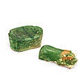 A sancai 'tiger' <b>pillow</b>, Liao dynasty and a carved Cizhou green-glazed 'floral' <b>pillow</b>, Song dynasty