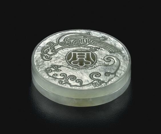 A rare white jade 'dragon and phoenix' tally, Qinq dynasty