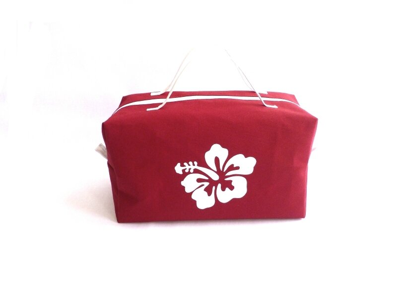 Trousse de toilette femme rouge et fleur hibiscus blanche